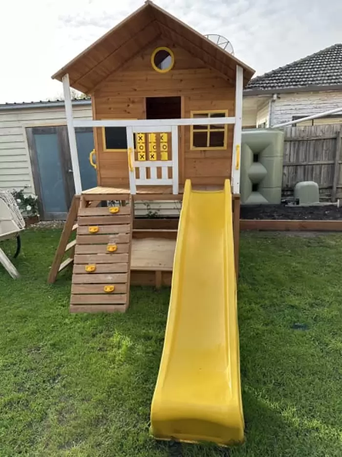 $1,450 Cubby House with Yellow Slide